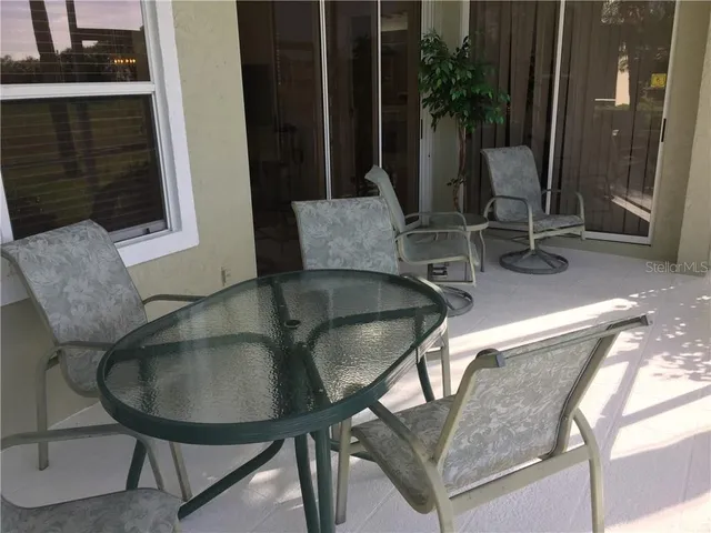 a view of a lake with houses in the back