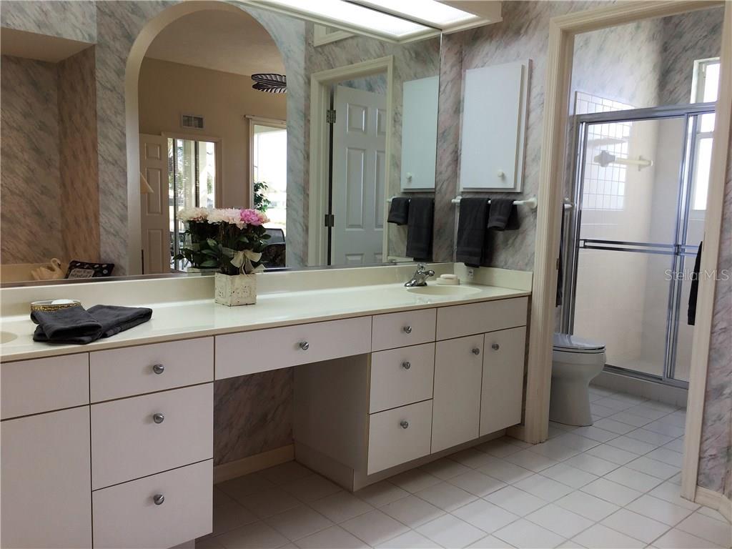 549 Fallbrook Drive Venice, FL 34292 - Photo 3 of 25 a bathroom with a double vanity sink and mirror