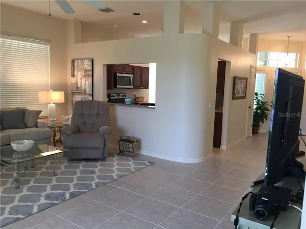 a view of a livingroom with furniture and a flat screen tv