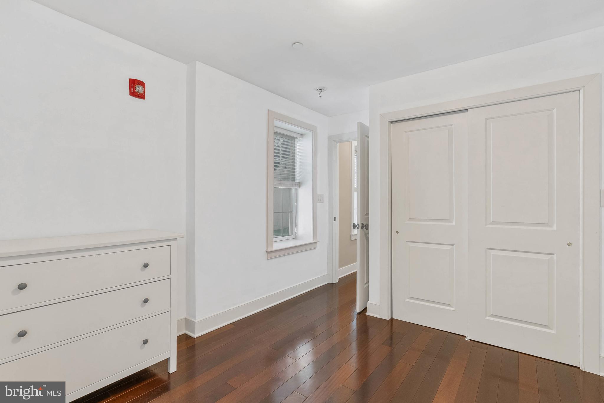 1522 Race Street, Unit 1 Philadelphia, PA 19102 - Photo 16 of 26 a view of an empty room and wooden floor