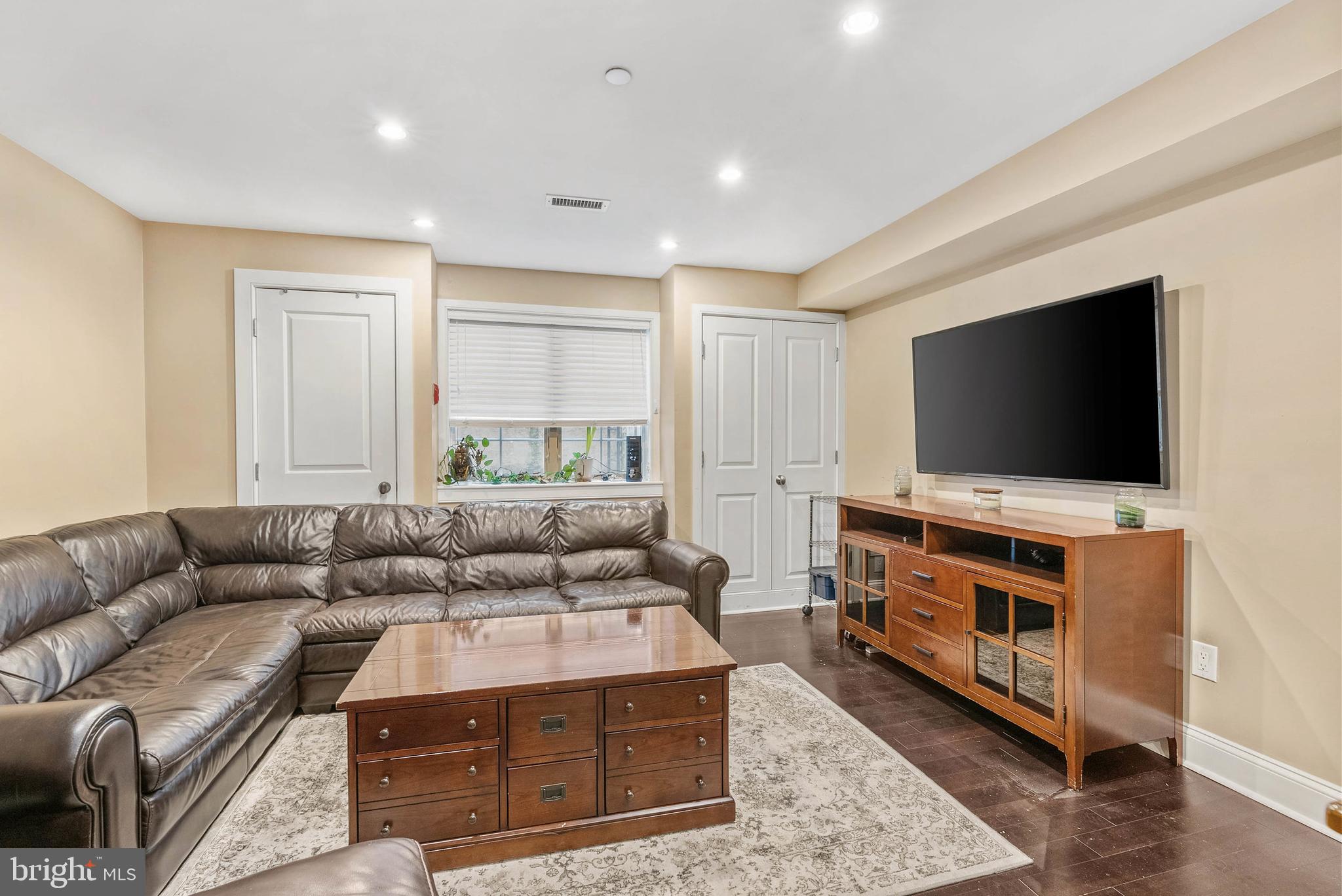 1522 Race Street, Unit 1 Philadelphia, PA 19102 - Photo 21 of 26 a living room with furniture and a flat screen tv