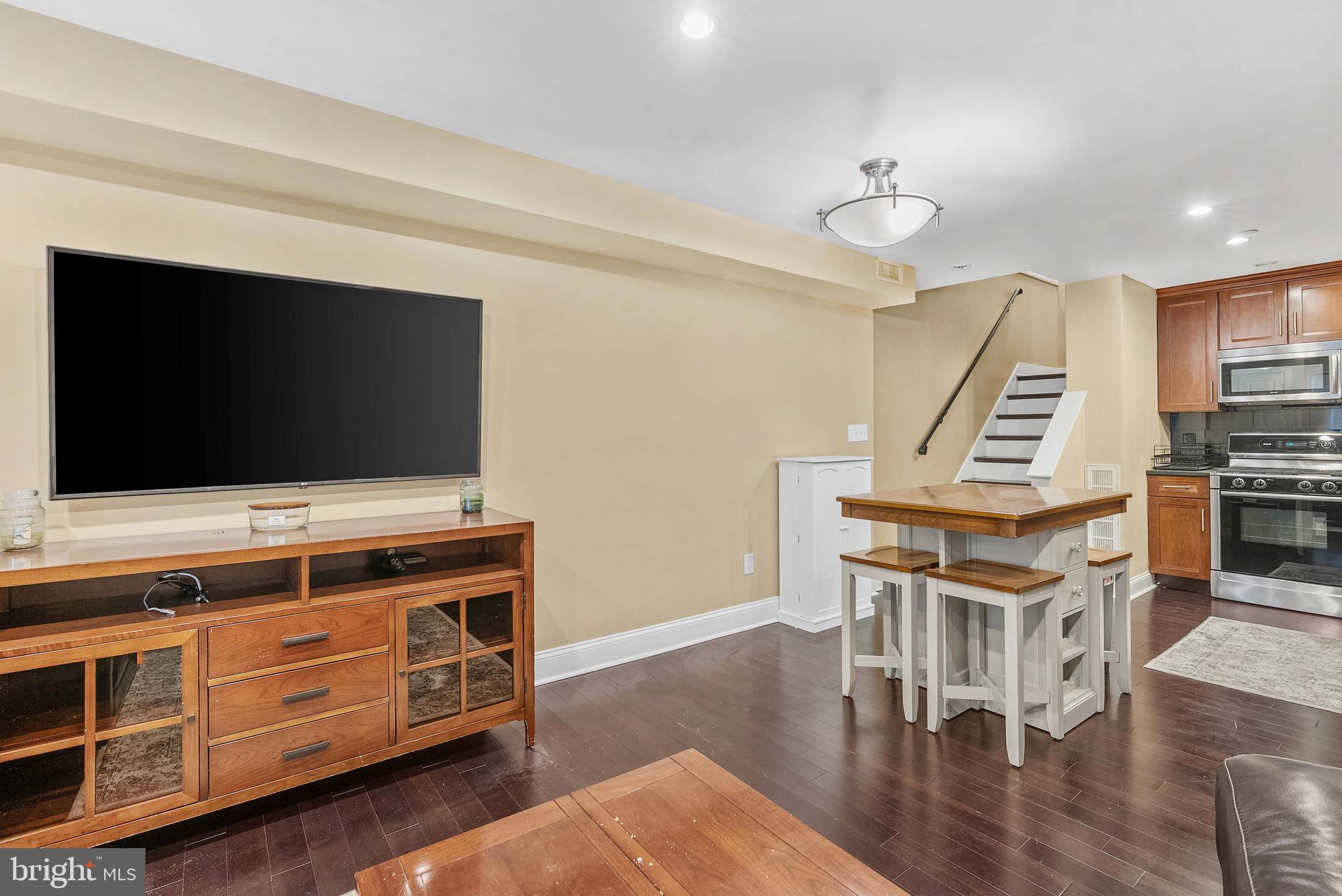 1522 Race Street, Unit 1 Philadelphia, PA 19102 - Photo 22 of 26 a living room with furniture and a flat screen tv