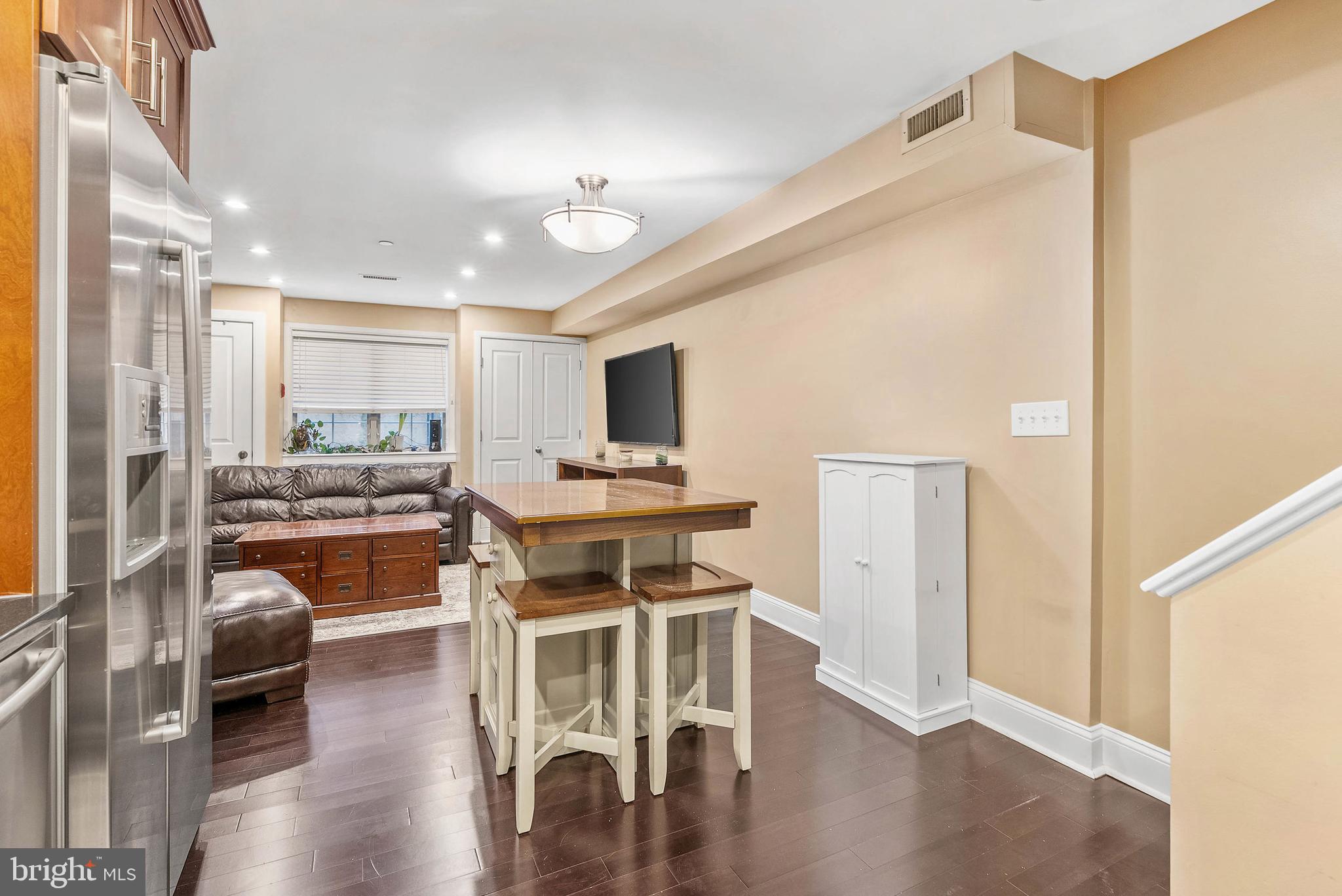 1522 Race Street, Unit 1 Philadelphia, PA 19102 - Photo 26 of 26 a kitchen with a table and chairs