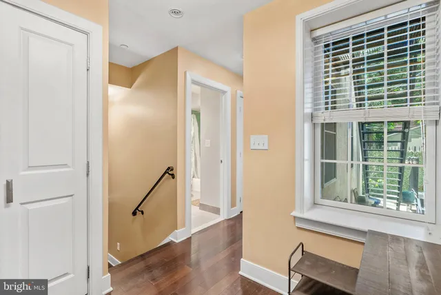 a view of front door and wooden floor