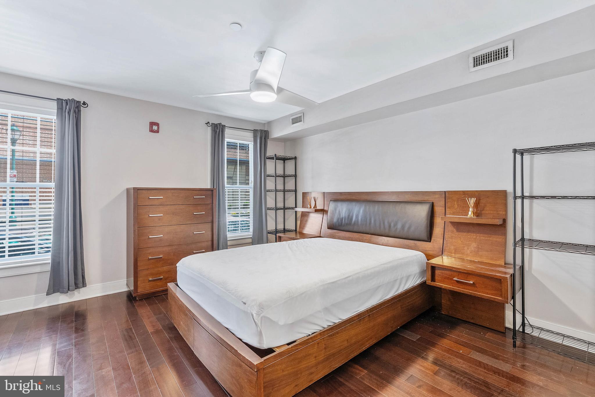 1522 Race Street, Unit 1 Philadelphia, PA 19102 - Photo 8 of 26 a bedroom with a bed and wooden floor