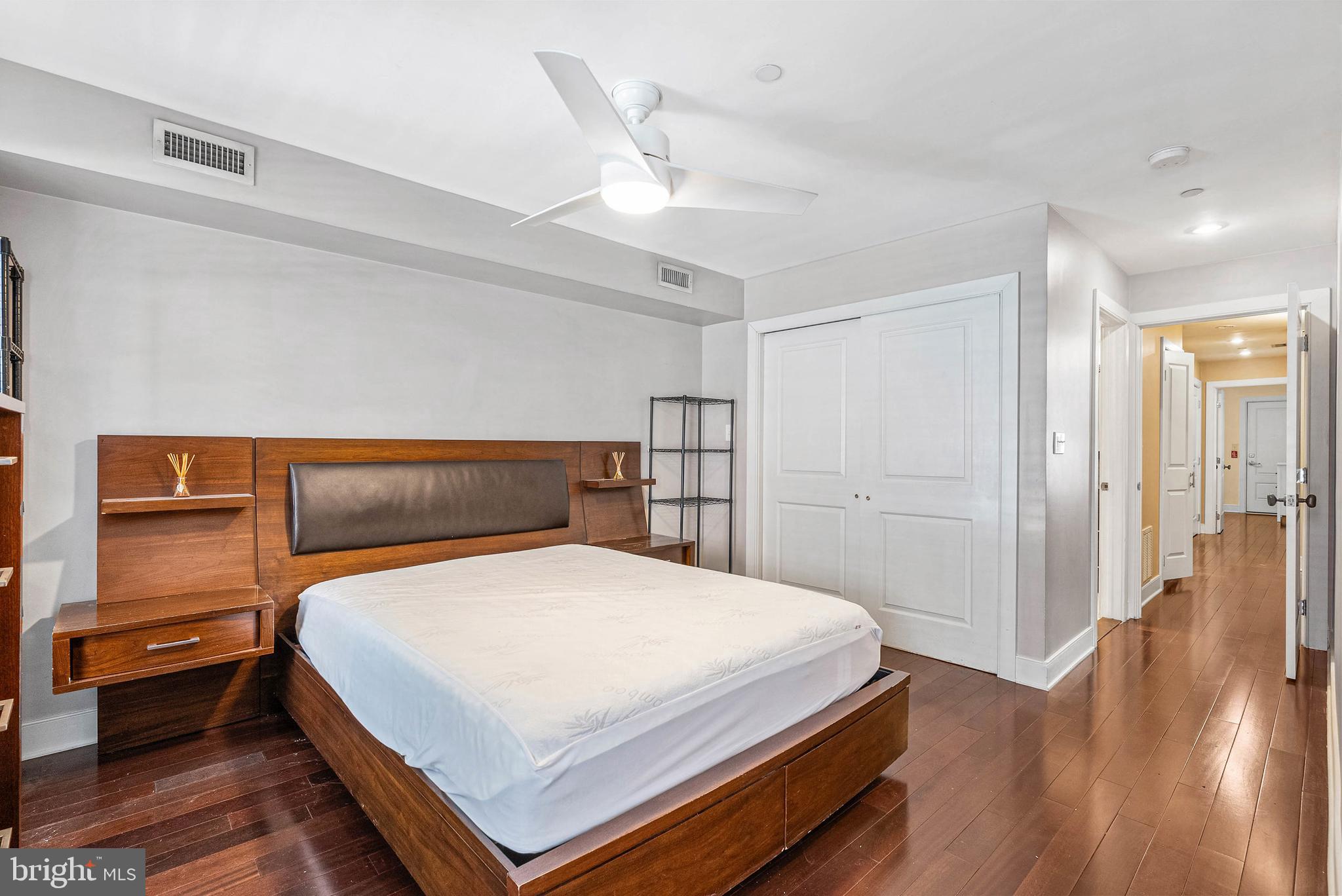 1522 Race Street, Unit 1 Philadelphia, PA 19102 - Photo 9 of 26 a bedroom with a bed and wooden floor