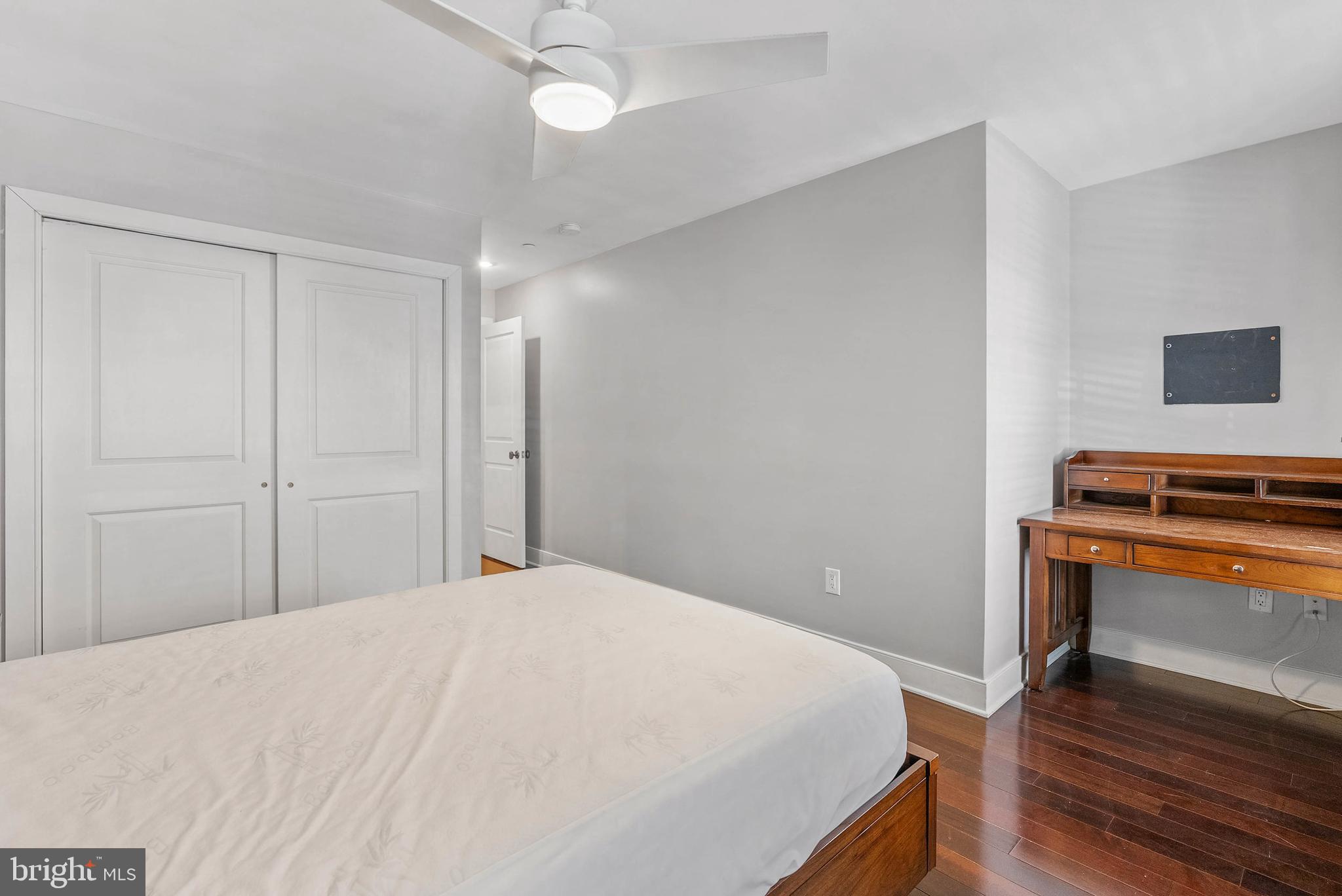 1522 Race Street, Unit 1 Philadelphia, PA 19102 - Photo 10 of 26 a bedroom with a bed and a chandelier