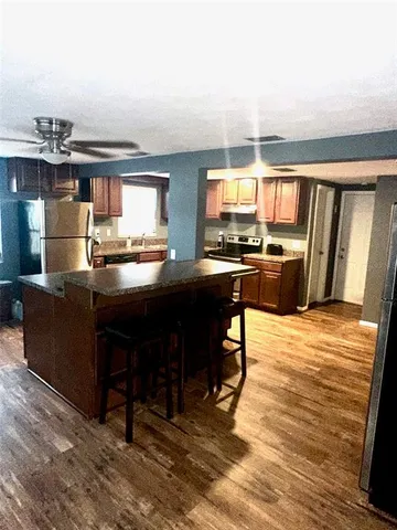 a kitchen with granite countertop lots of counter top space