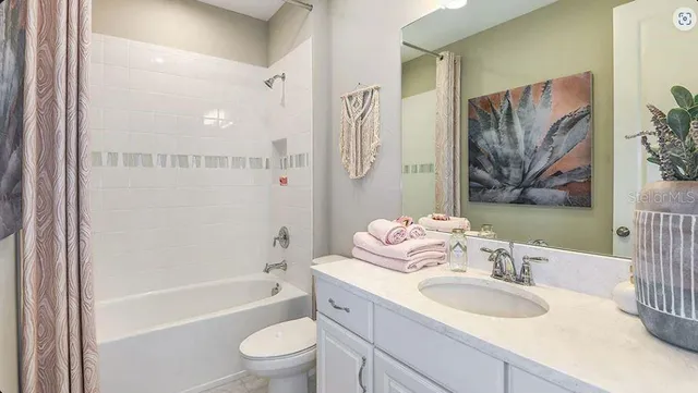 a bathroom with a sink a toilet and a bathtub