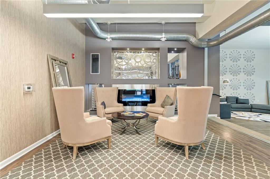 2434 Smallman Street, Unit 416 Pittsburgh, PA 15222 - Photo 13 of 31 a living room with furniture a rug and a large window
