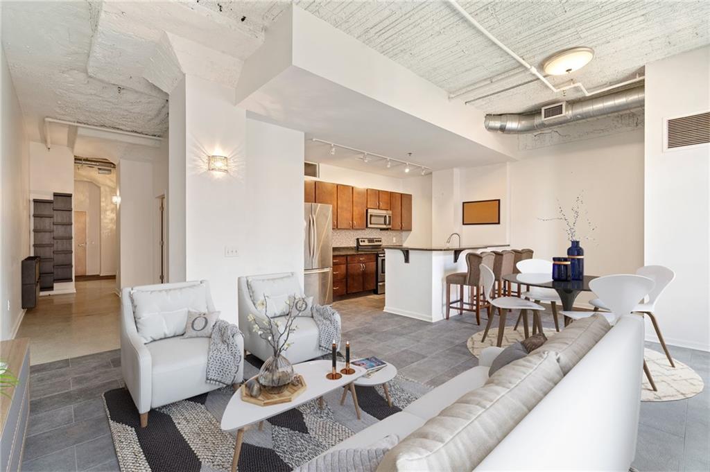 2434 Smallman Street, Unit 416 Pittsburgh, PA 15222 - Photo 3 of 31 a living room with furniture and view of kitchen