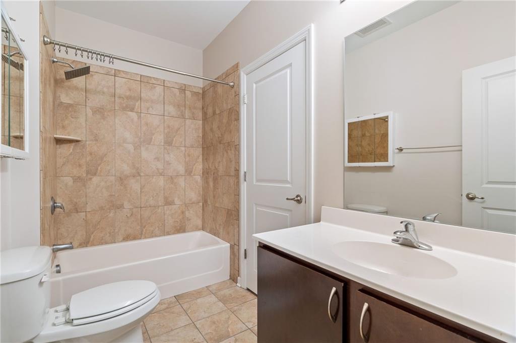 2434 Smallman Street, Unit 416 Pittsburgh, PA 15222 - Photo 9 of 31 a bathroom with a sink a toilet and bathtub