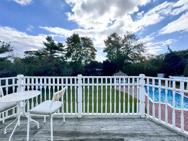 a view of a chair and table on the wooden floor