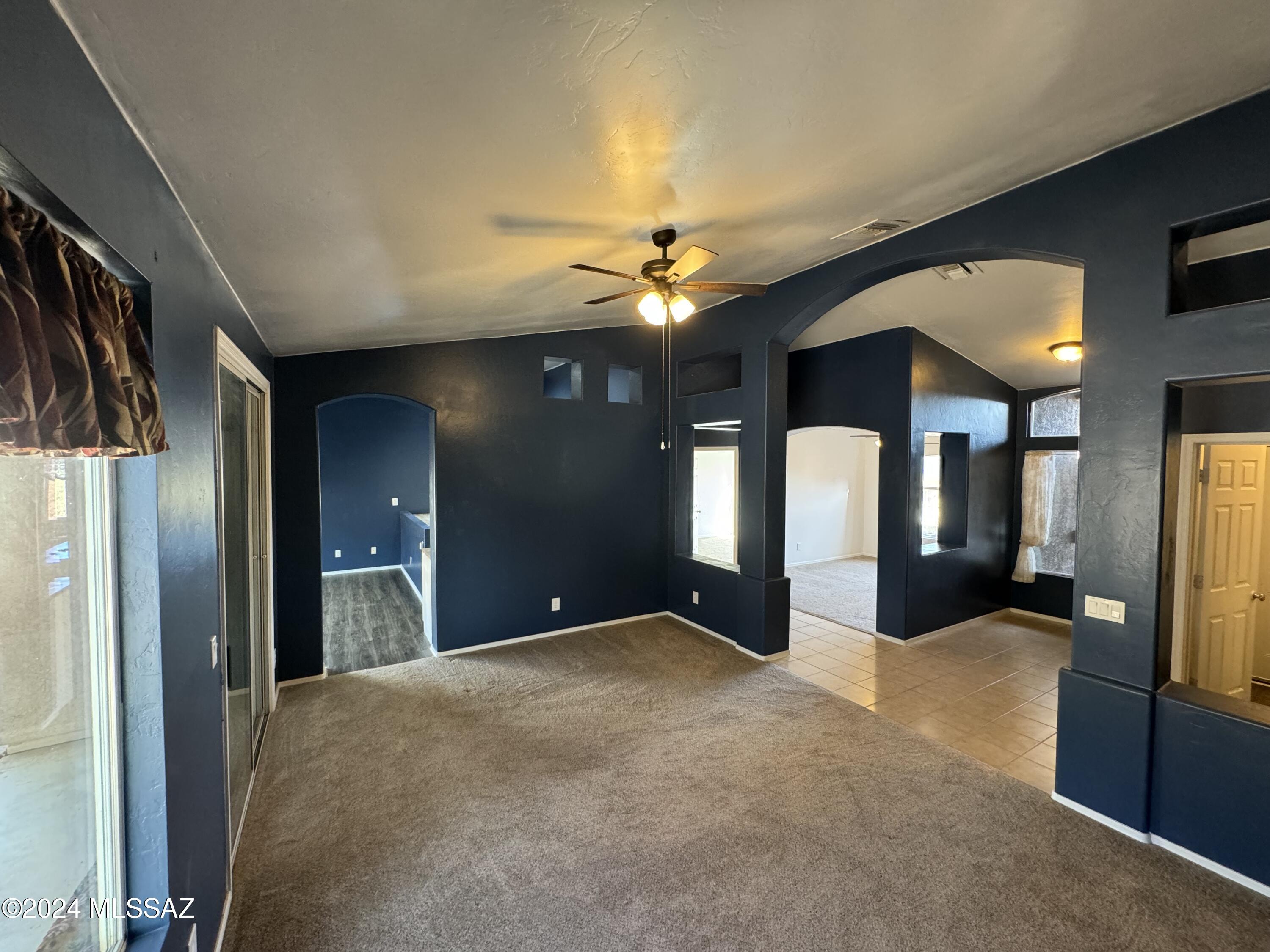 1841 America Court Rio Rico, AZ 85648 - Photo 5 of 38 a view of a hallway with a chandelier