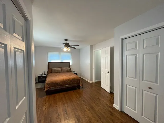 a bedroom with bed and window