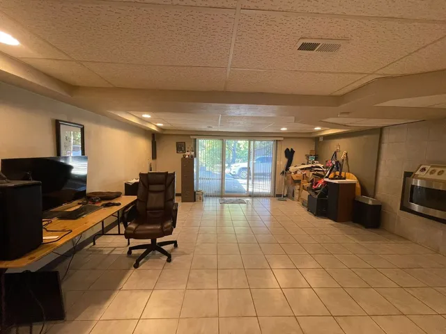a livingroom with furniture and a flat screen tv