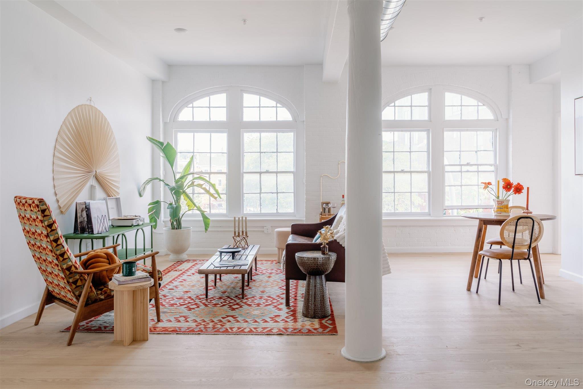 155 River Street, Unit BASEMENT C Troy, NY 12180 - Photo 5 of 22 a living room with furniture and a large window