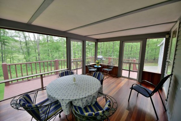68 Silvermine Road Boxford, MA 01921 - Photo 30 of 30 a living room with furniture and a floor to ceiling window
