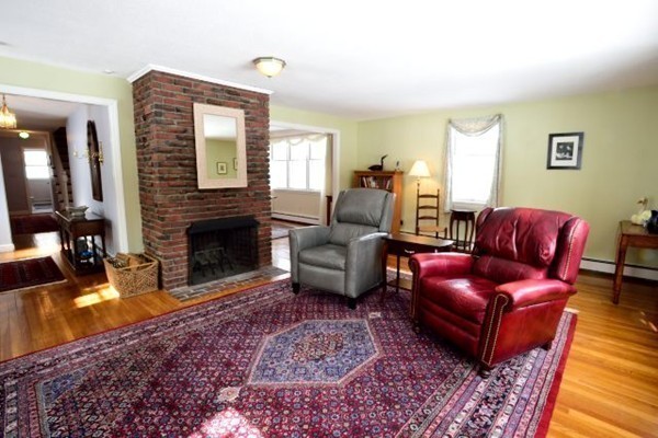 68 Silvermine Road Boxford, MA 01921 - Photo 5 of 30 a living room with furniture a rug and a fireplace