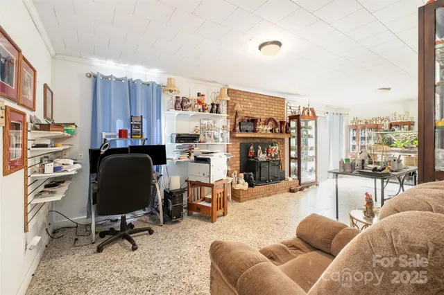a view of a livingroom with workspace and a couch
