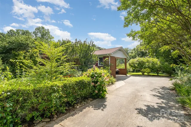 a view of a house with garden and plants