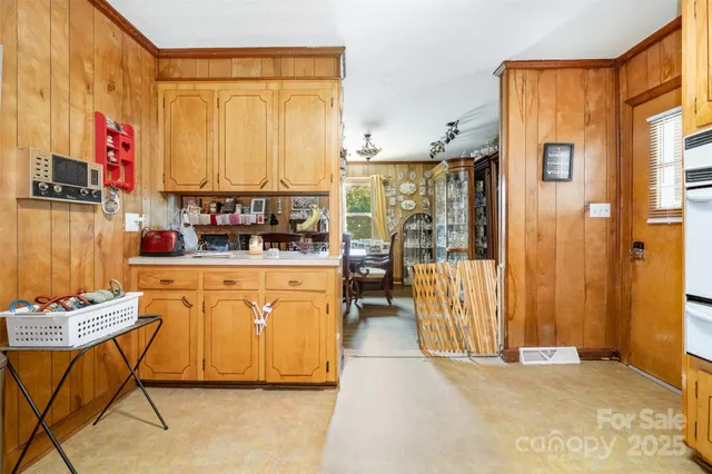 a kitchen with stainless steel appliances granite countertop a refrigerator and a stove