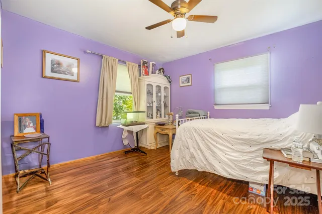 a bed room with a bed and a window