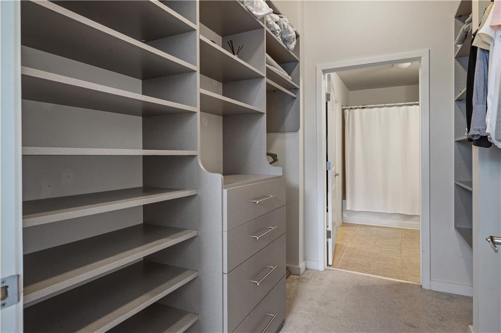 250 Pharr Road Northeast, Unit 606 Atlanta, GA 30305 - Photo 16 of 31 a view of walk in closet with empty racks
