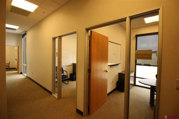 a view of an empty room with a bathroom