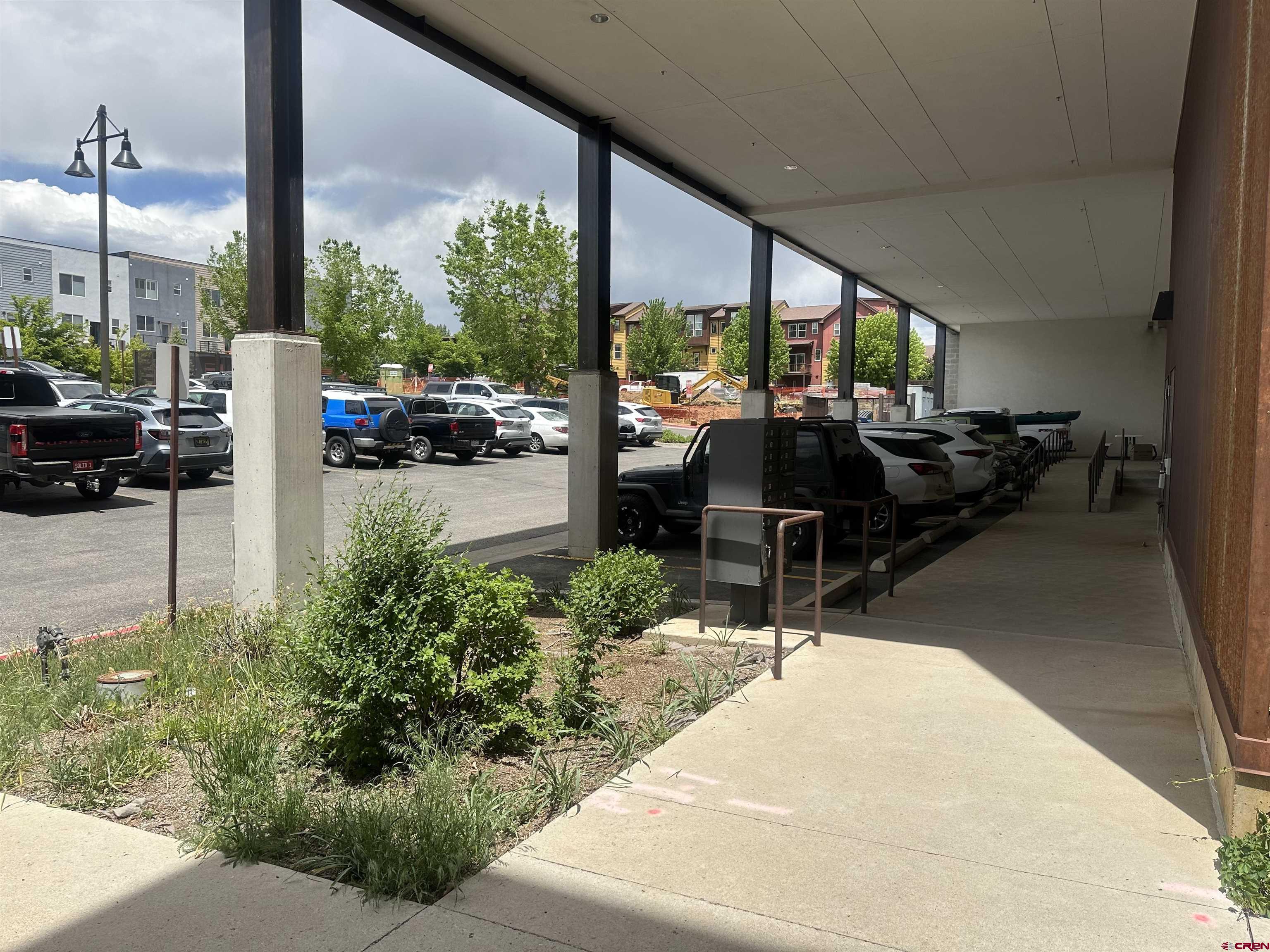 175 Mercado Street, Unit 234 Durango, CO 81301 - Photo 18 of 22 a building outdoor space with patio furniture and potted plants