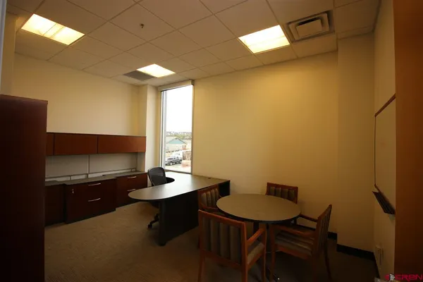 a view of a hallway with a room