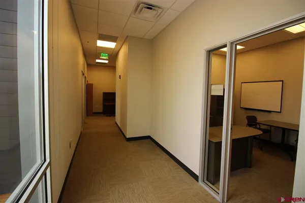 a view of walk in closet with empty room