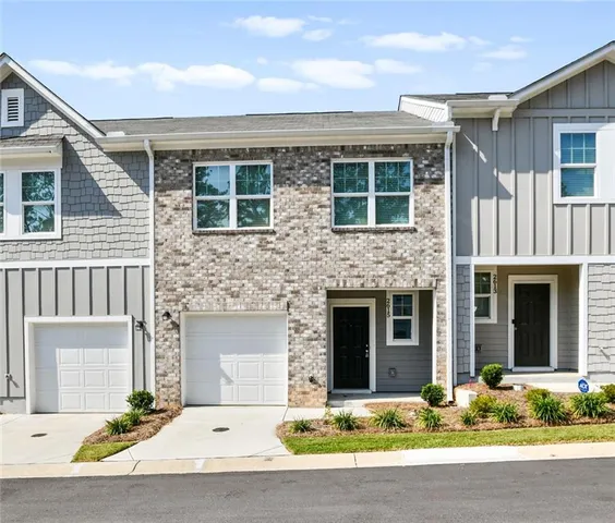 a front view of a house with yard