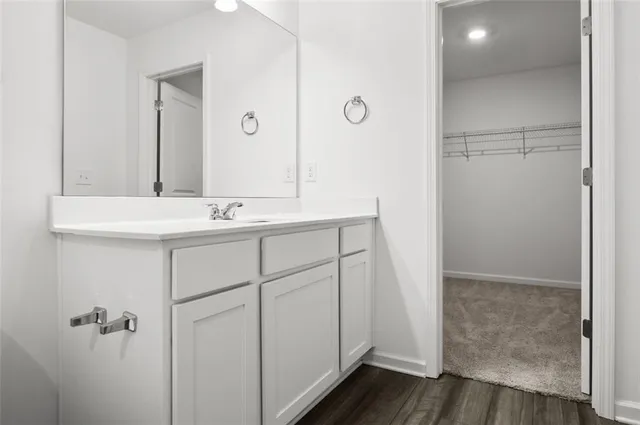 a bathroom with a sink and mirror