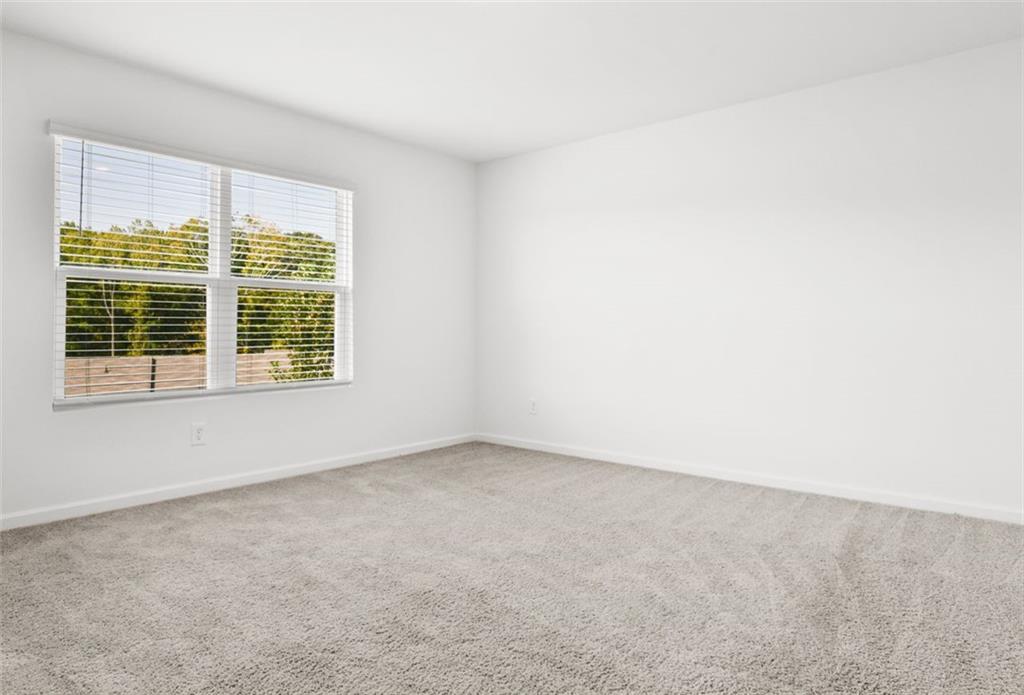 2615 Senegal Way, Unit 2615 Atlanta, GA 30331 - Photo 15 of 20 a view of an empty room with a window