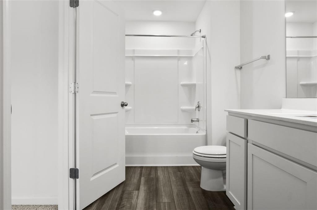 2615 Senegal Way, Unit 2615 Atlanta, GA 30331 - Photo 18 of 20 a bathroom with a sink toilet and shower