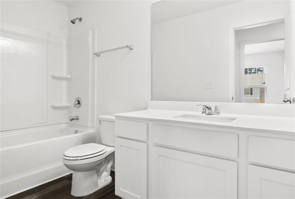 2615 Senegal Way, Unit 2615 Atlanta, GA 30331 - Photo 19 of 20 a bathroom with a toilet sink vanity tub and shower