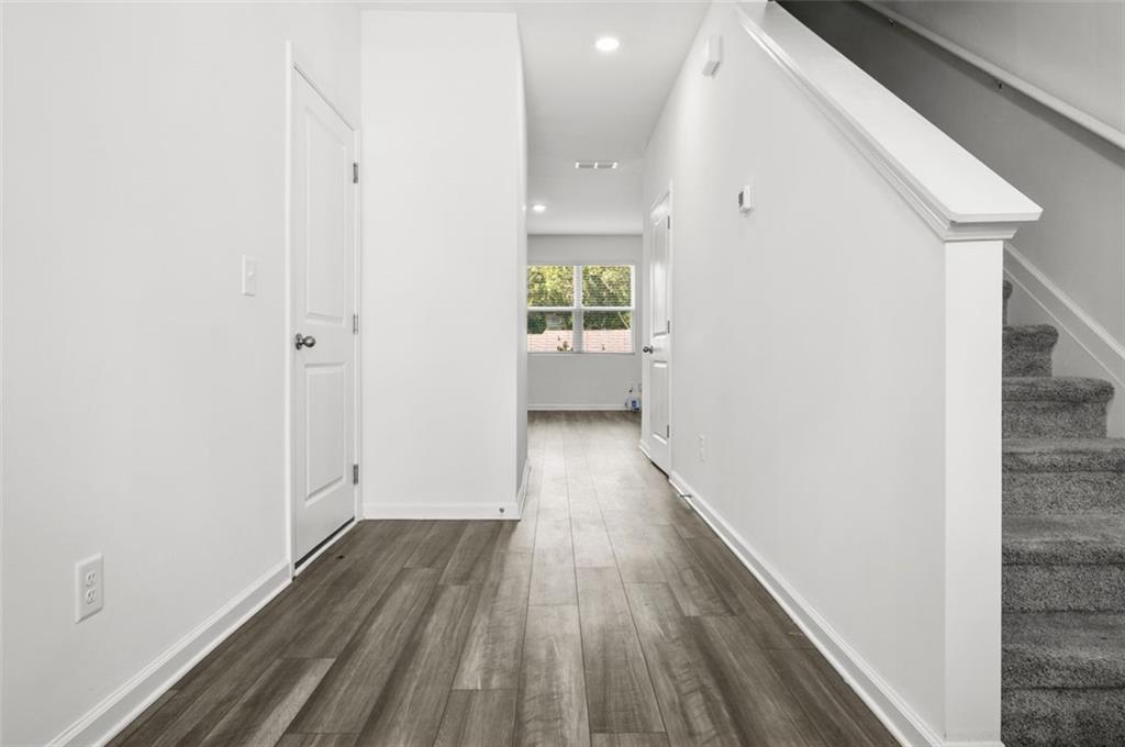 2615 Senegal Way, Unit 2615 Atlanta, GA 30331 - Photo 3 of 20 a view of hallway with wooden floor