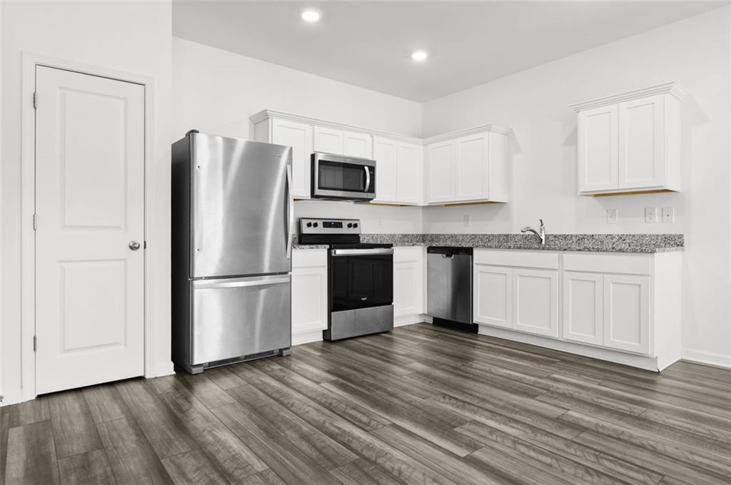 2615 Senegal Way, Unit 2615 Atlanta, GA 30331 - Photo 6 of 20 a kitchen with stainless steel appliances a refrigerator sink and cabinets