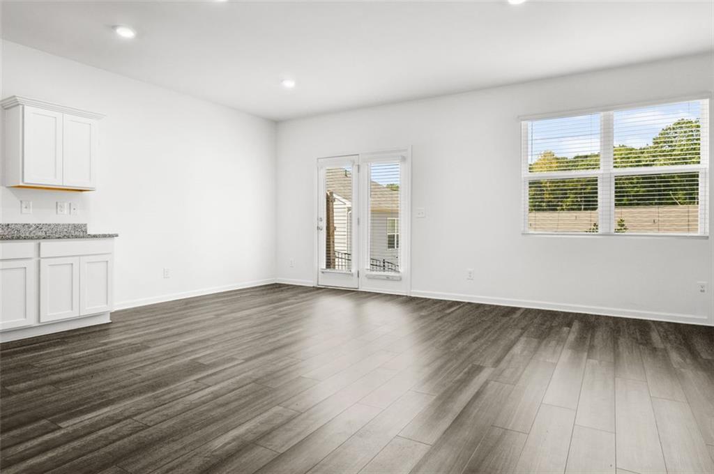2615 Senegal Way, Unit 2615 Atlanta, GA 30331 - Photo 9 of 20 an empty room with wooden floor and windows