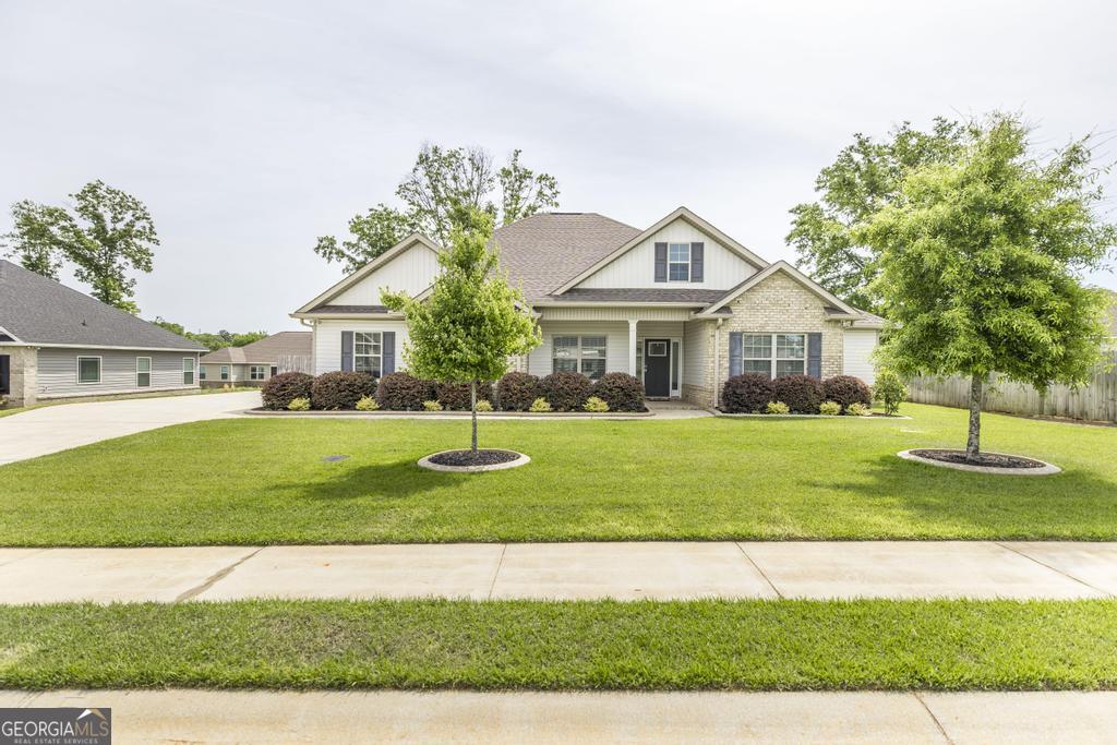 a front view of a house with a yard
