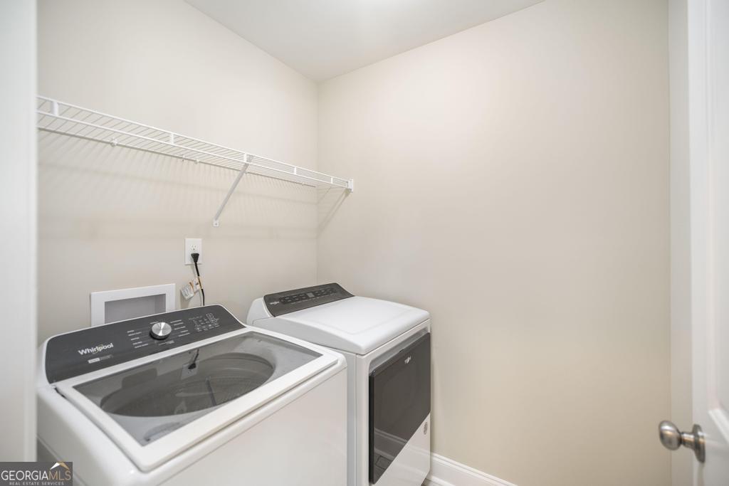 216 Georgian Walk Byron, GA 31008 - Photo 17 of 37 a utility room with dryer and washer