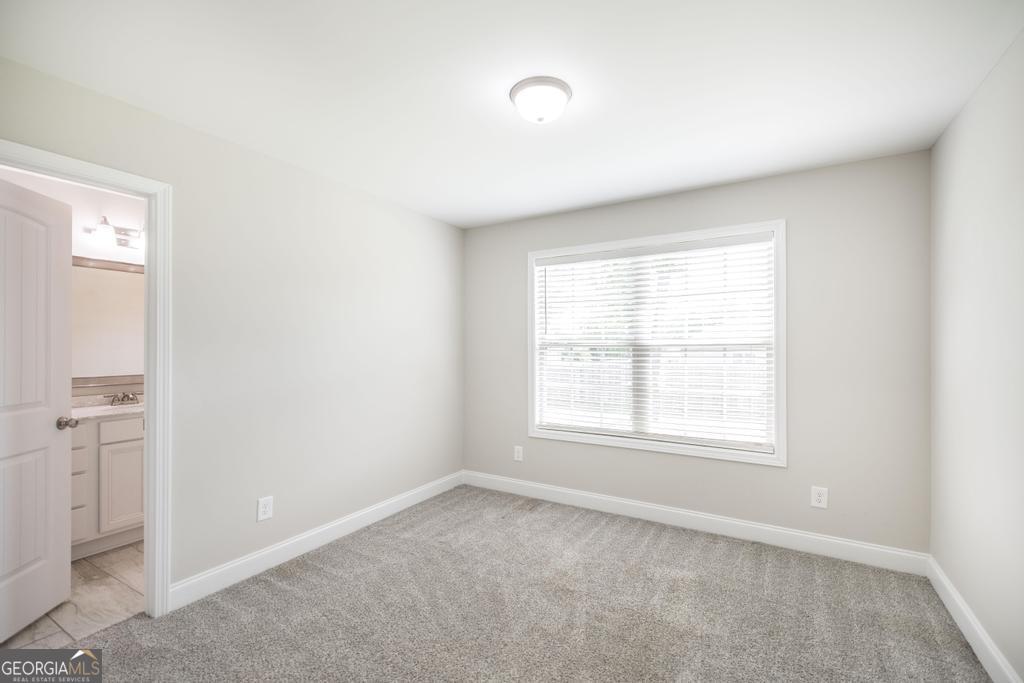 216 Georgian Walk Byron, GA 31008 - Photo 18 of 37 an empty room with windows