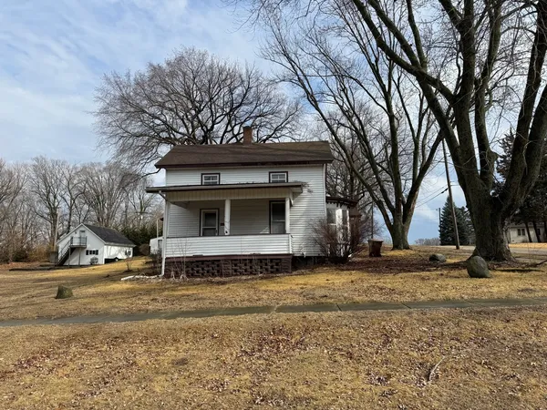 a view of a house with a snow in the yard
