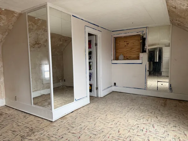 a view of empty room with windows