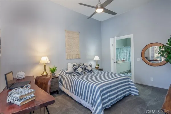 a bedroom with bed and a window