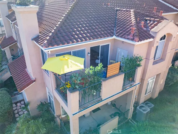 a aerial view of a house with a yard