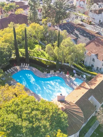 a view of a swimming pool with a yard
