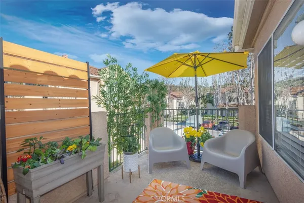 a view of a swimming pool with a couches in a patio