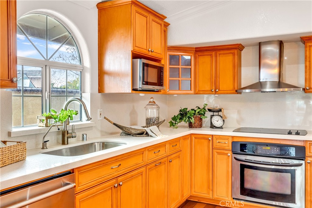 1724 El Rey Road San Pedro, CA 90732 - Photo 13 of 51 a kitchen with a sink a counter top space and cabinets